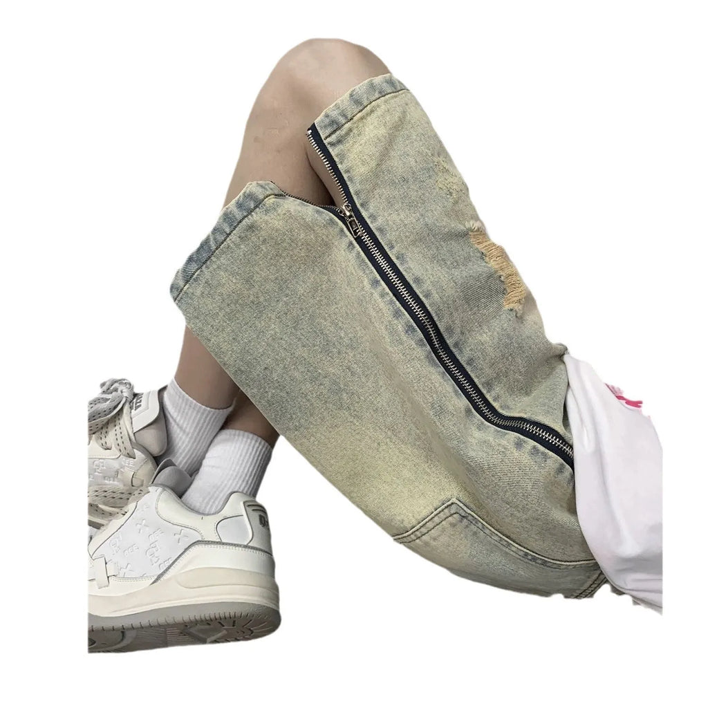 Men's blue denim shorts with loose five-point cut and yellow mud ripped detailing, button fly, straight leg