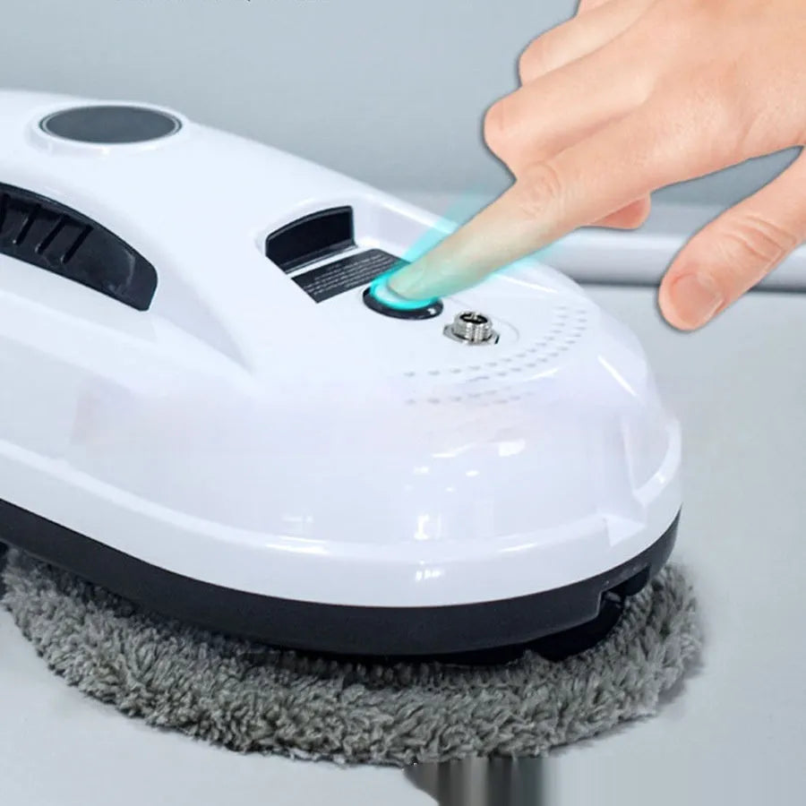 White automatic window cleaning robot with remote control, compact 28cm by 13cm by 9cm size