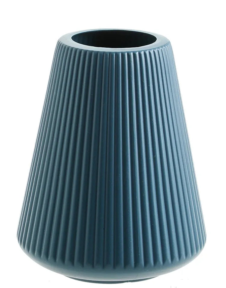 Colourful melamine plastic decorative flower vase measuring 16x20cm on desktop