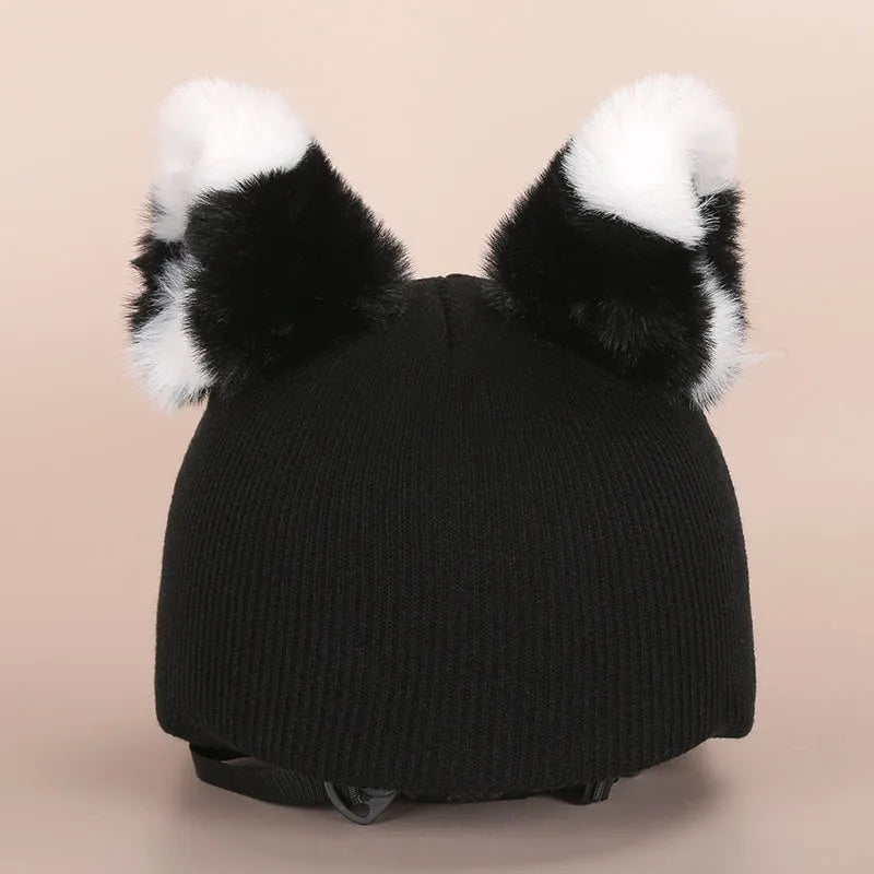 Soft plush cartoon decoration cap placed on a ski helmet for personalisation.