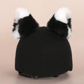 Soft plush cartoon decoration cap placed on a ski helmet for personalisation.