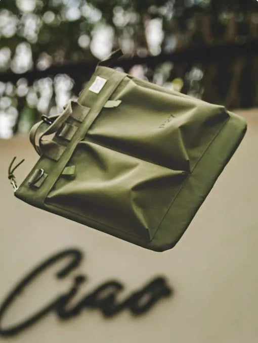 Canvas crossbody messenger bag in military green with 15 inch laptop compartment and shoulder strap