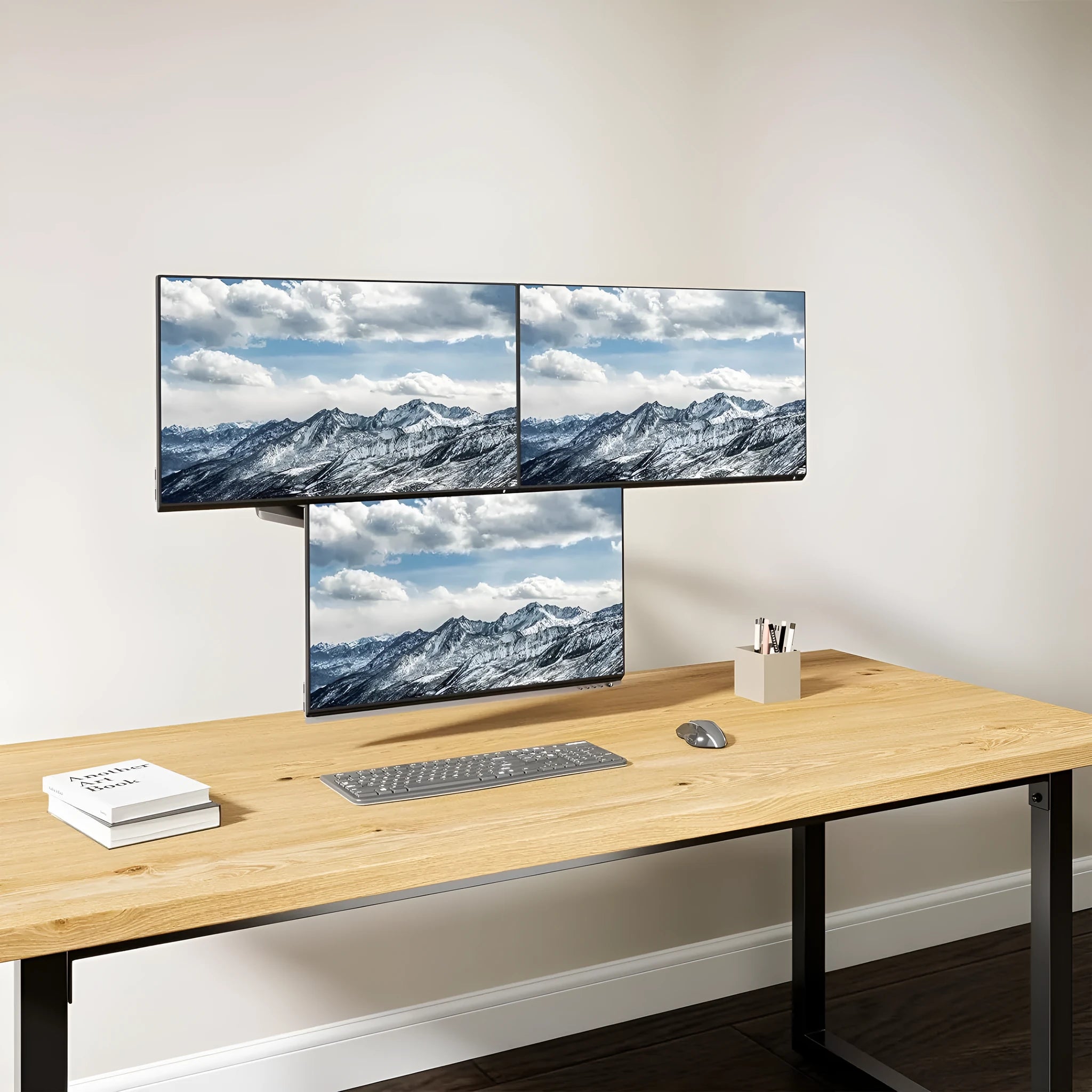 Black three-arm gas spring monitor mount for 27-inch computer screens