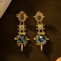 A pair of gold colour alloy stud earrings with geometric round shape in retro court style