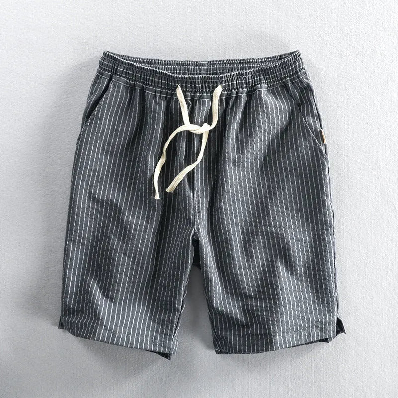 Men's striped casual loose straight shorts in cotton fabric on a hanger