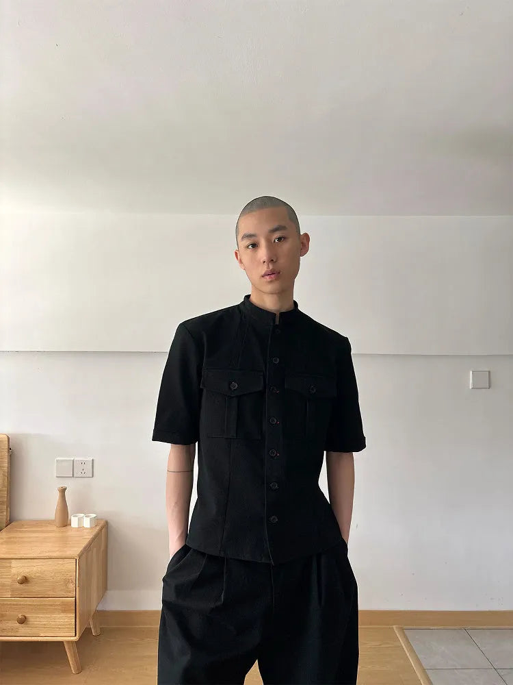 Black handmade half-sleeve hunting shirt with a shirt collar and loose fit on a mannequin.