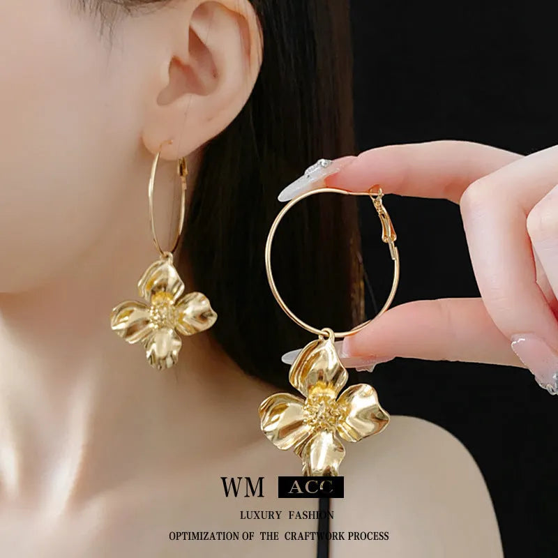 Silver needle drop metal flower earrings with geometric vintage design in gold and silver electroplated finishes