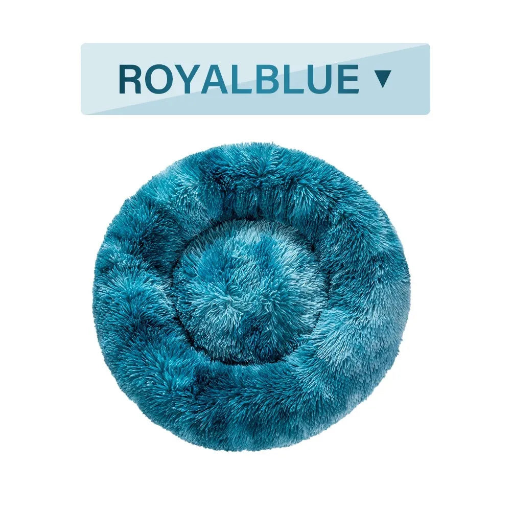 Fluffy donut-shaped dog bed with raised edges in luxury long plush fabric