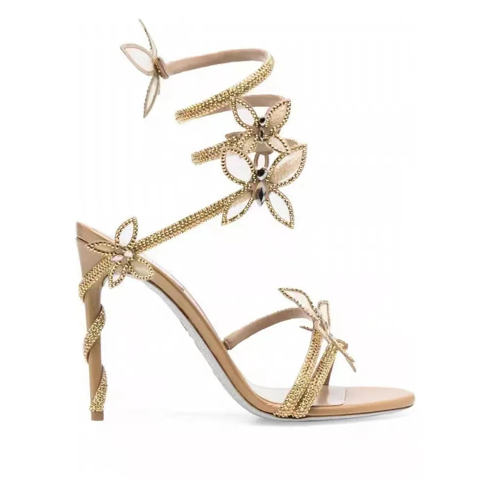 Snake butterfly rhinestone flower stiletto heel Roman sandals in gold with buckle closure and super high heel