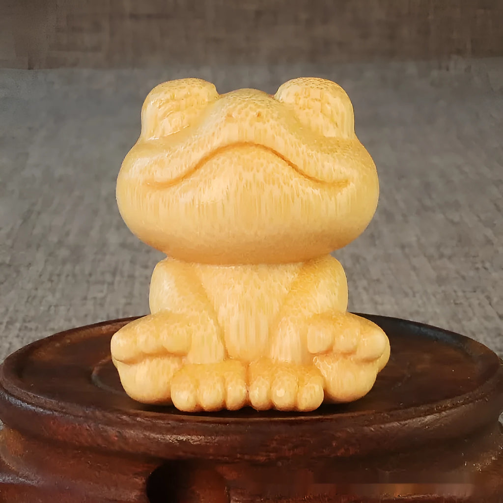 Solid bamboo smiling frog carving ornament measuring 5cm height with cartoon design