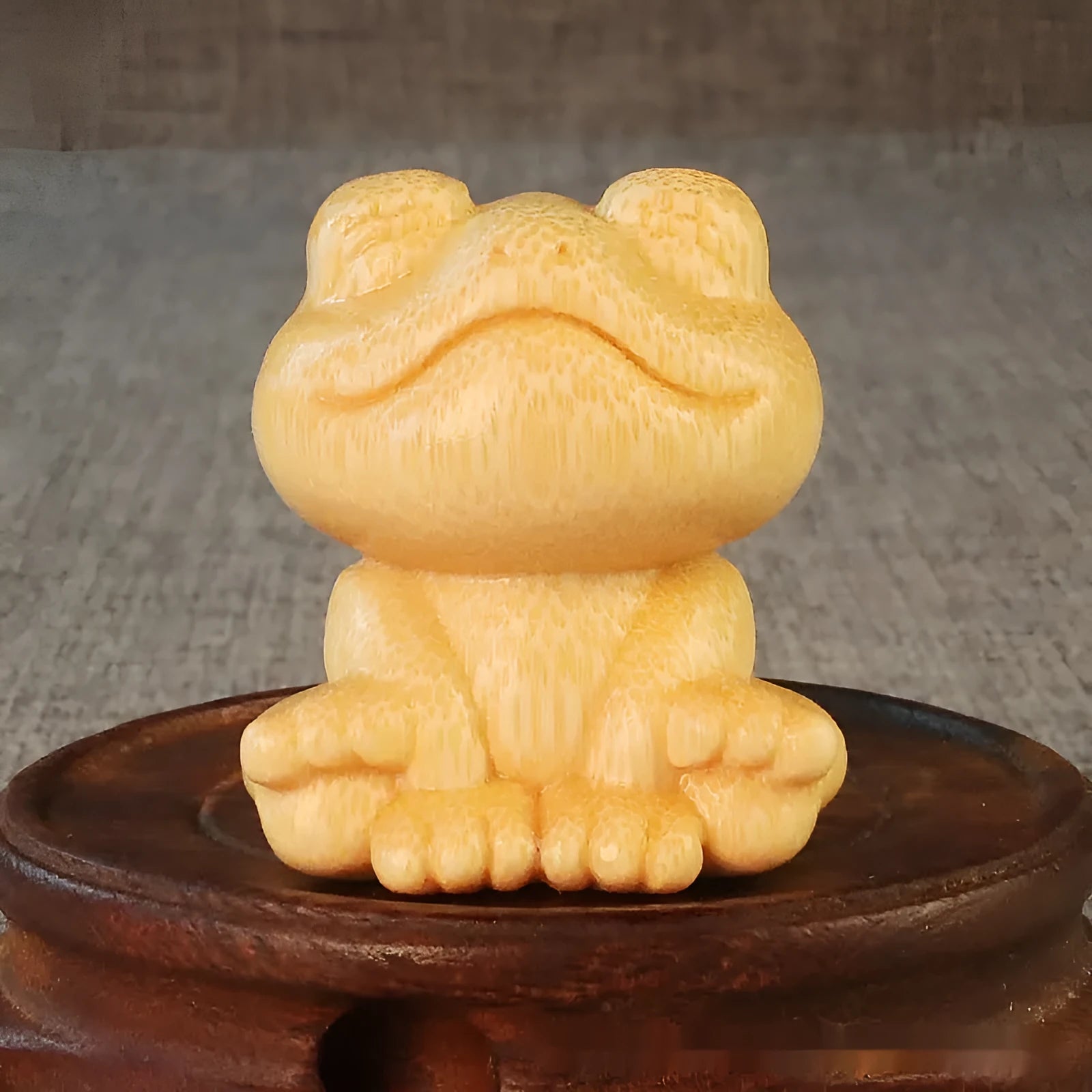Solid bamboo smiling frog carving ornament measuring 5cm height with cartoon design