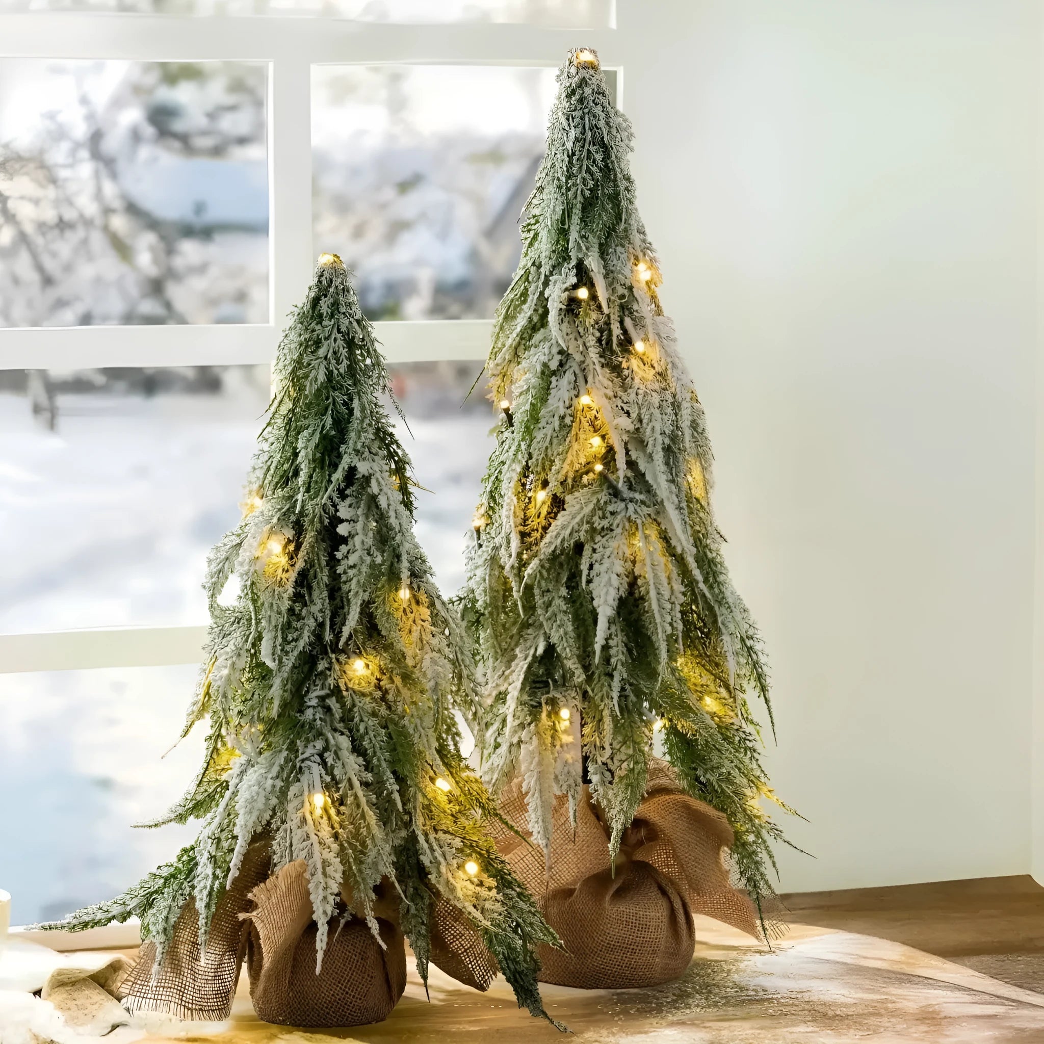 Small 24-inch plastic Christmas tree with PE snow sprayer effects and integrated lighting