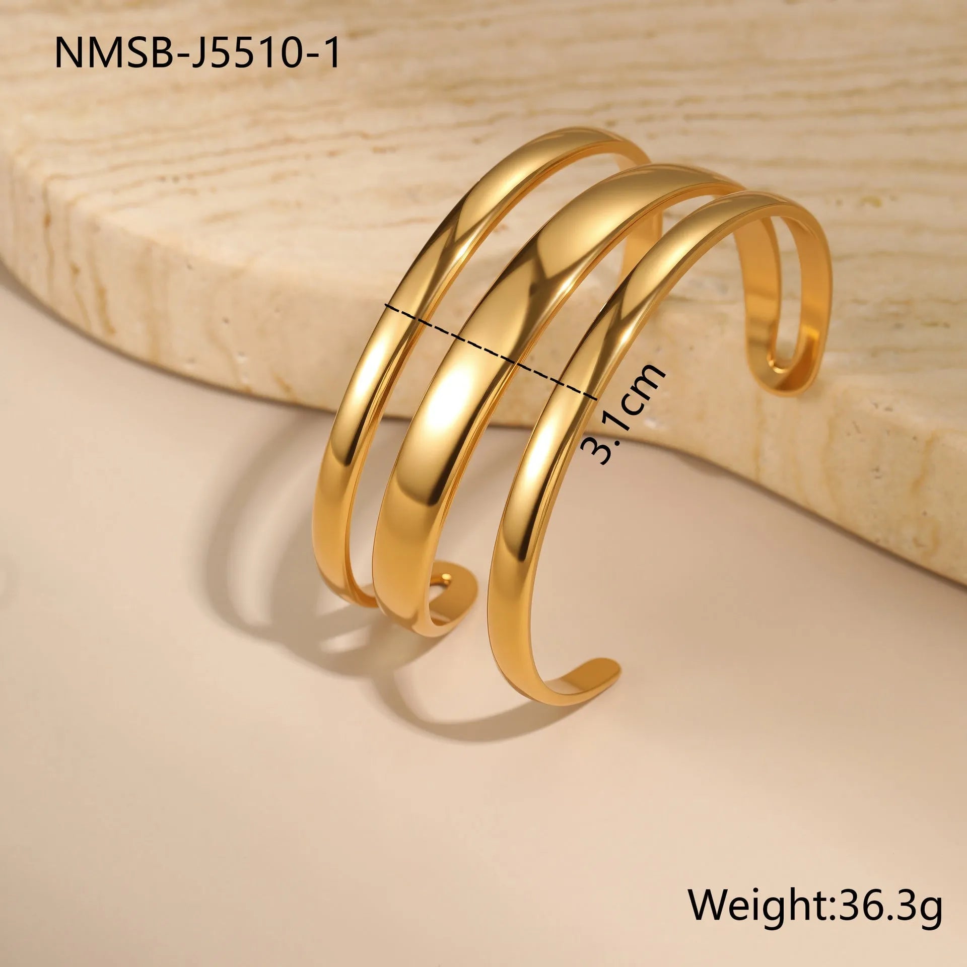 Stainless steel opening bracelet for women in gold or steel finish with geometric line design