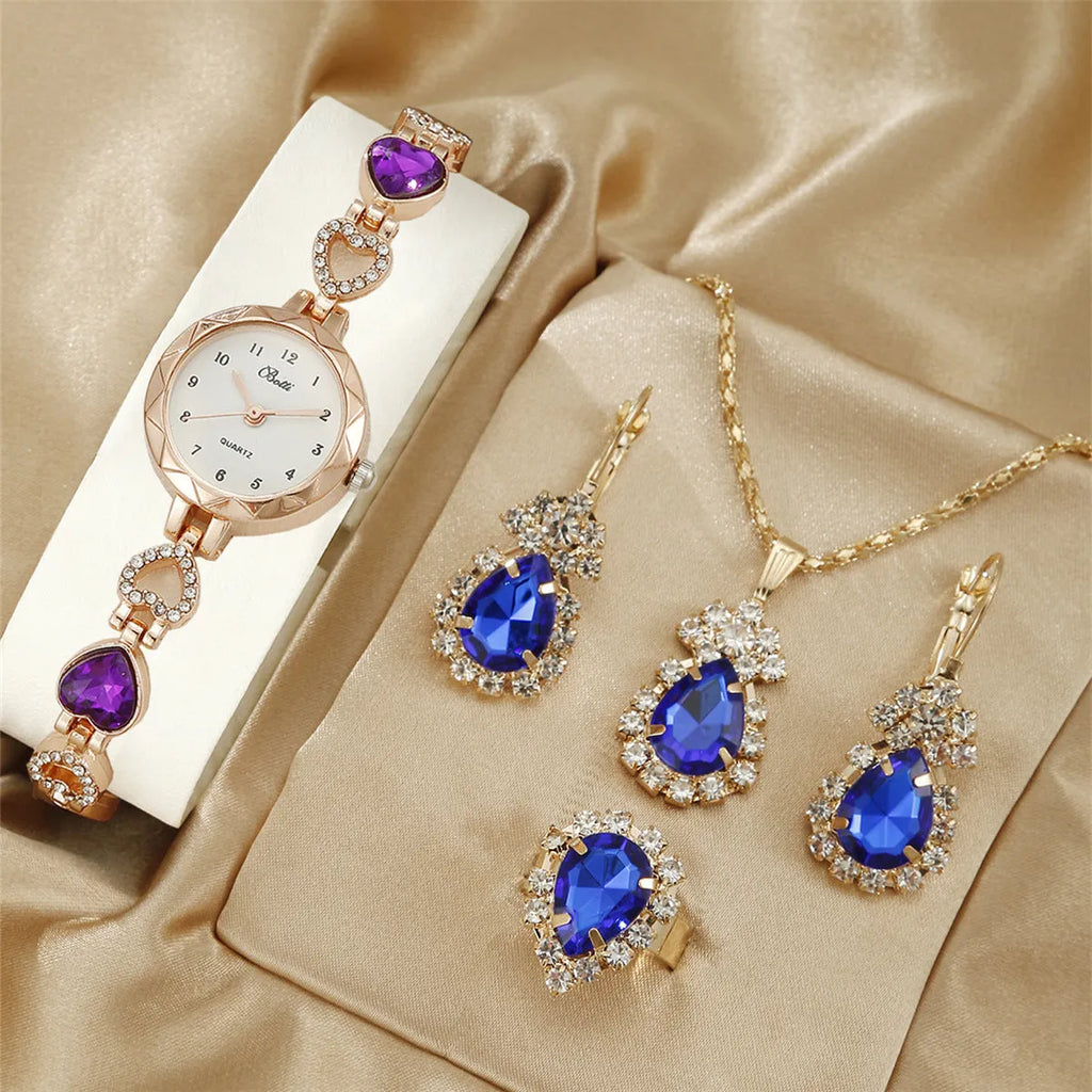 Women's simple disc light luxury quartz bracelet watch set in pink with matching earrings necklace and ring
