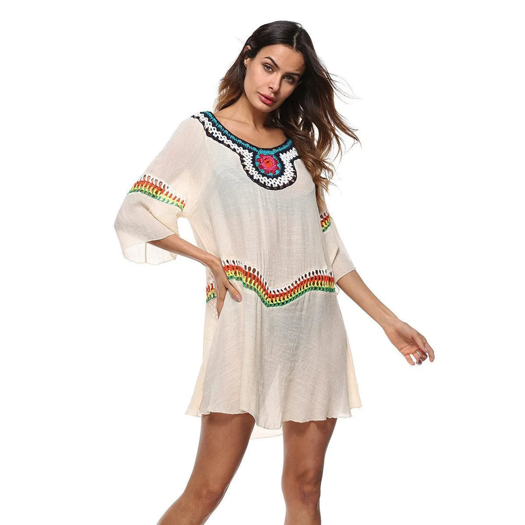 Crocheted ethnic style sun protection beach clothing for women in white, black, sapphire blue, or apricot.