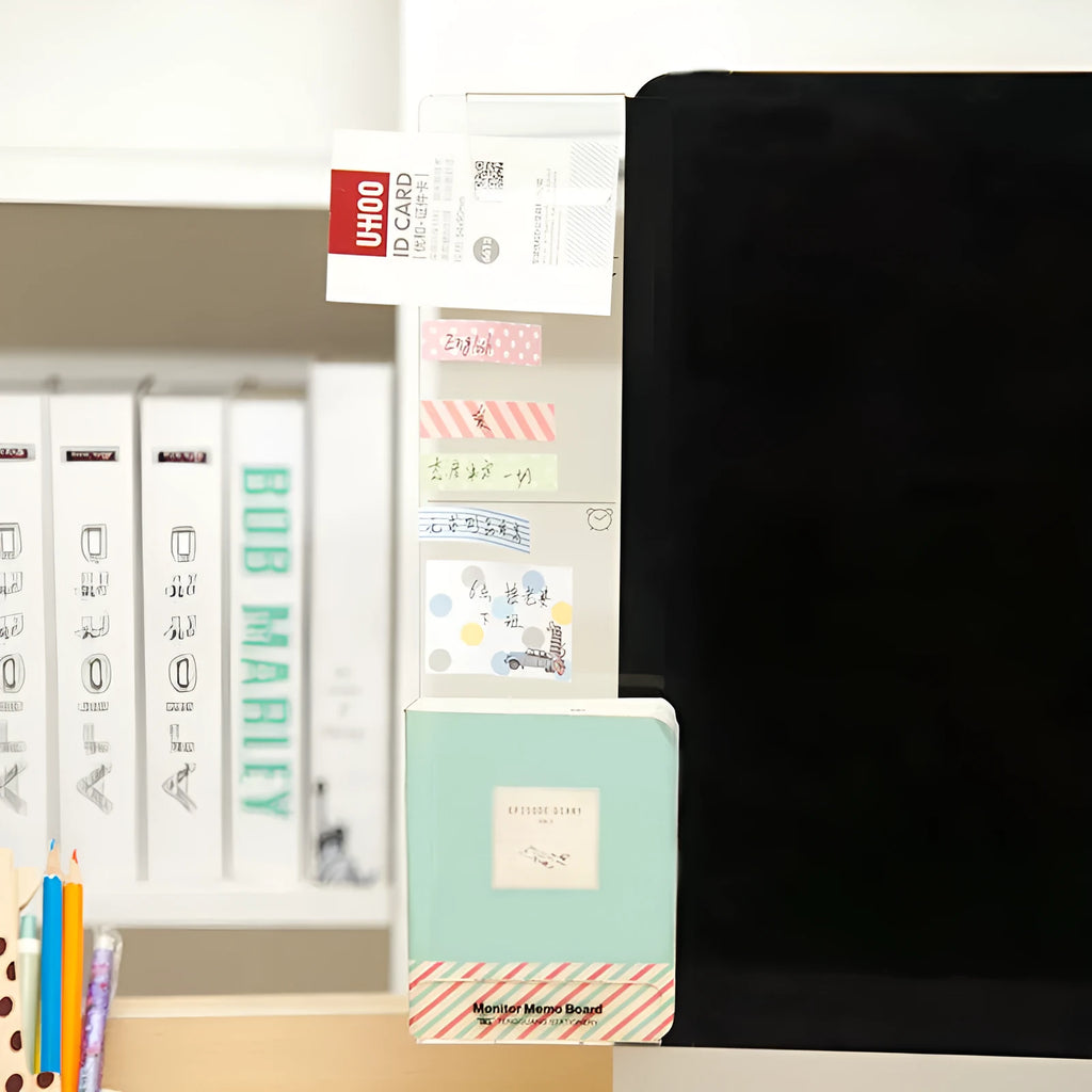 Clear acrylic memo board attached to a monitor with a post-it note on the surface