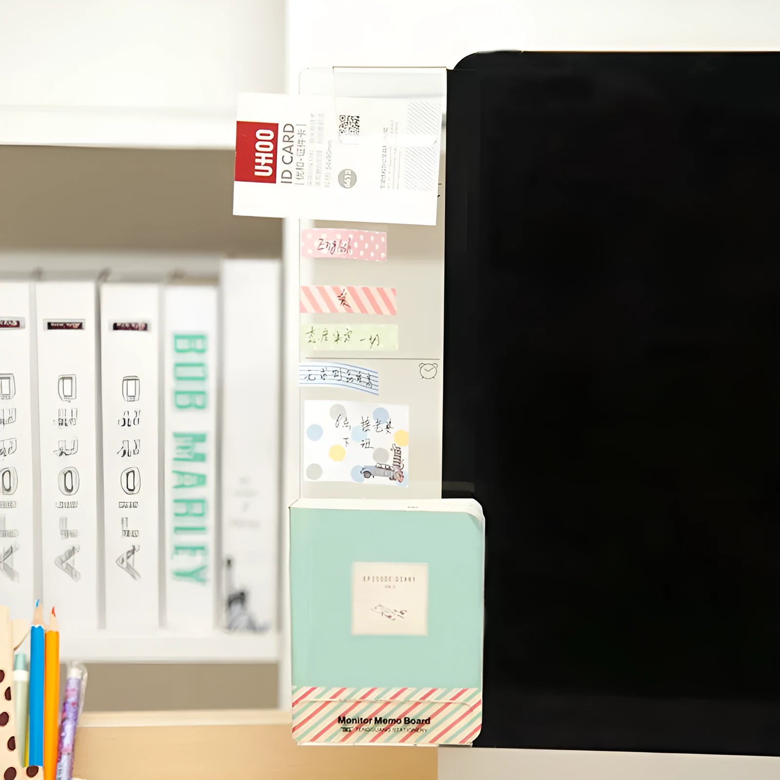 Clear acrylic memo board attached to a monitor with a post-it note on the surface