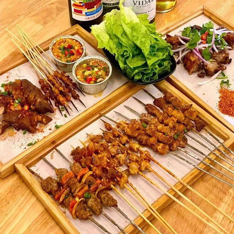 Brown handled bamboo square serving tray on a table