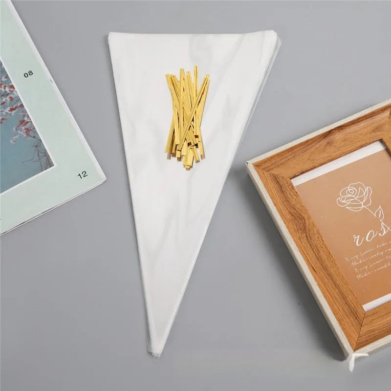 Clear triangle-shaped plastic packaging bag with a metallic twist tie at the top.