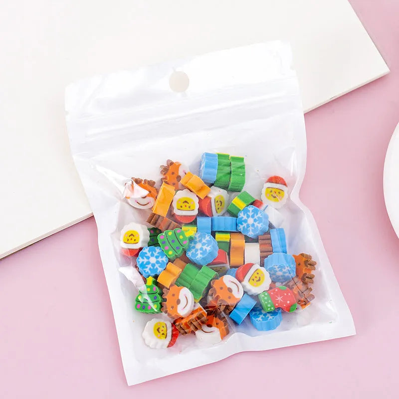 50 small colourful cartoon novelty erasers including fruit and animal shapes in a pearlescent film bag.