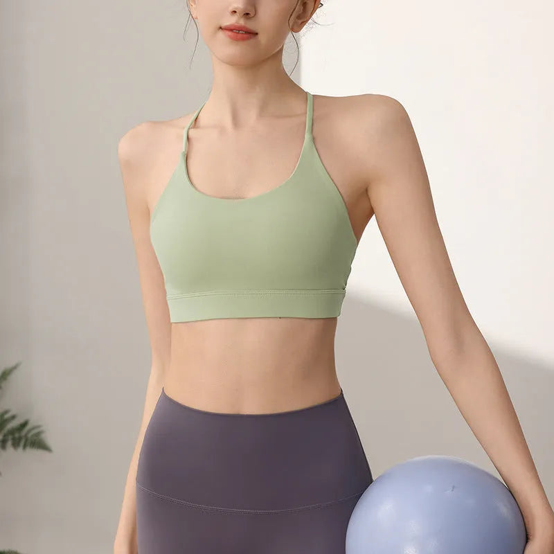 Women's nylon sports vest in green tea green colour with fixed double shoulder straps.