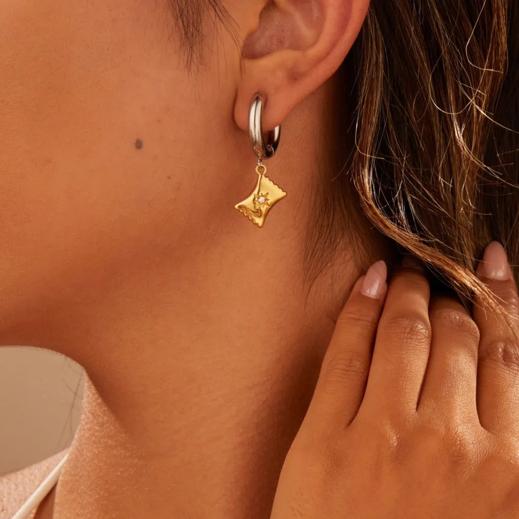 Women's stainless steel drop earrings with 18K gold electroplating in Christmas tree and heart shapes.