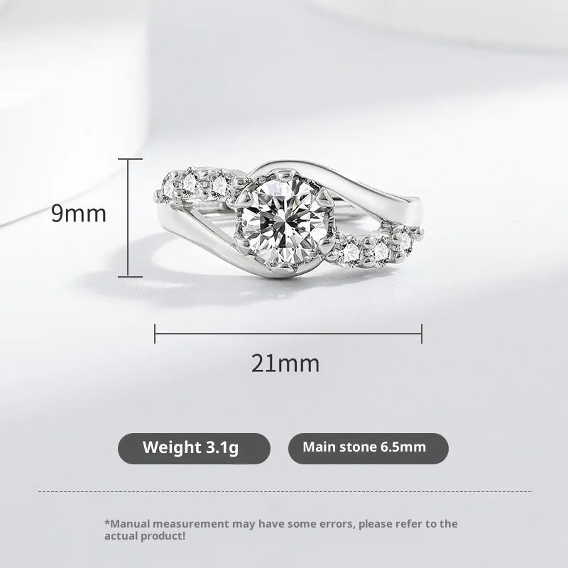 White gold colour crown-shaped copper ring on a plain background