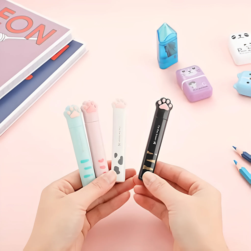 Cat paw mini folding craft scissors in four colours: black, blue, pink, and white, showing closed and open positions.