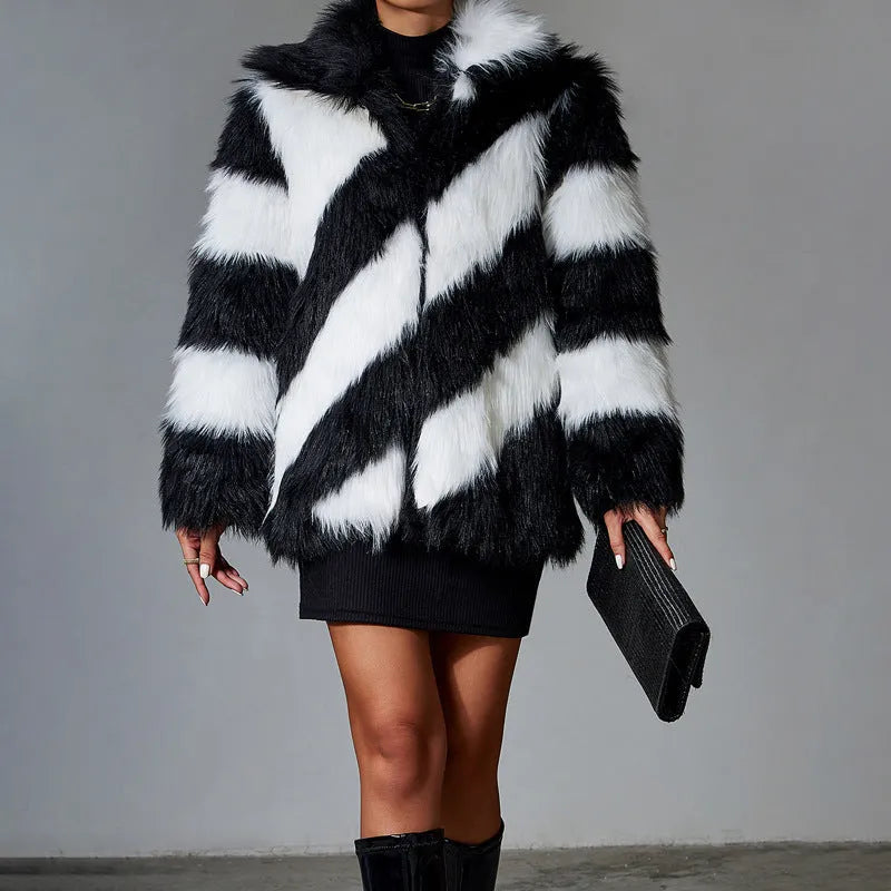 Women's faux fur coat with a contrasting colour lapel and a large fur collar.