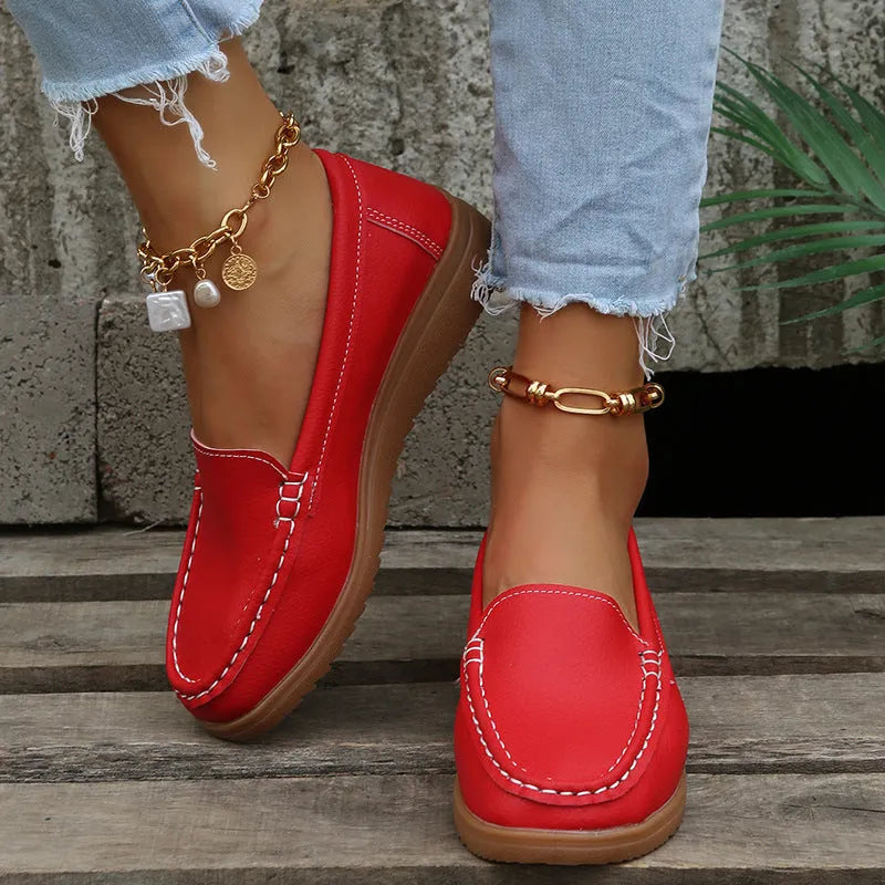 Women's flat laofer shoes in PU leather with car suture detail and a round toe, shown in multiple colours.