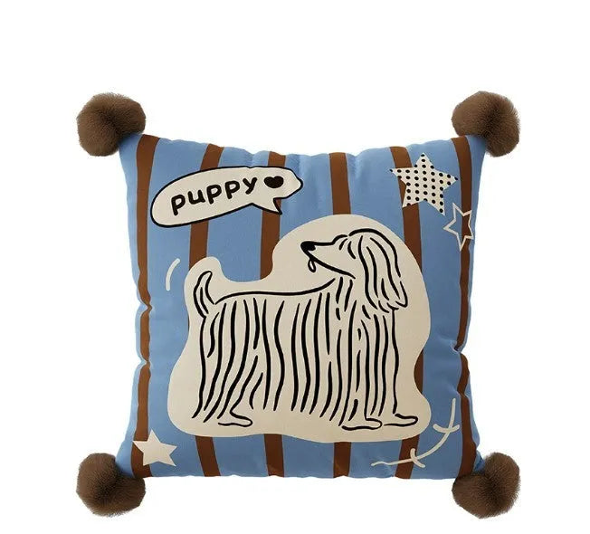Blue cartoon animal print decorative sofa cushion pillow on a grey couch.