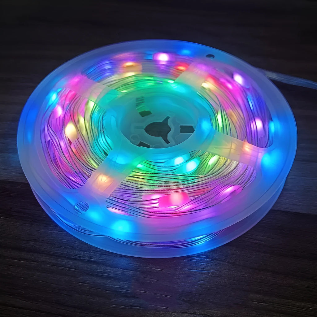Colourful LED light string with 100 bulbs on a 10-metre wire, showing battery pack and multiple mode settings.
