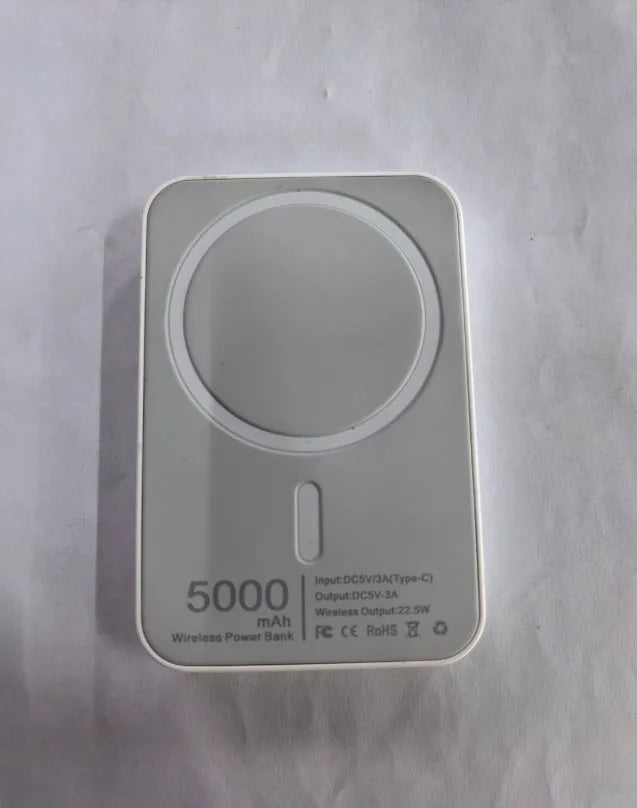 White portable magnetic wireless charger power bank showing compact design and charging surface