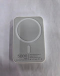 White portable magnetic wireless charger power bank showing compact design and charging surface