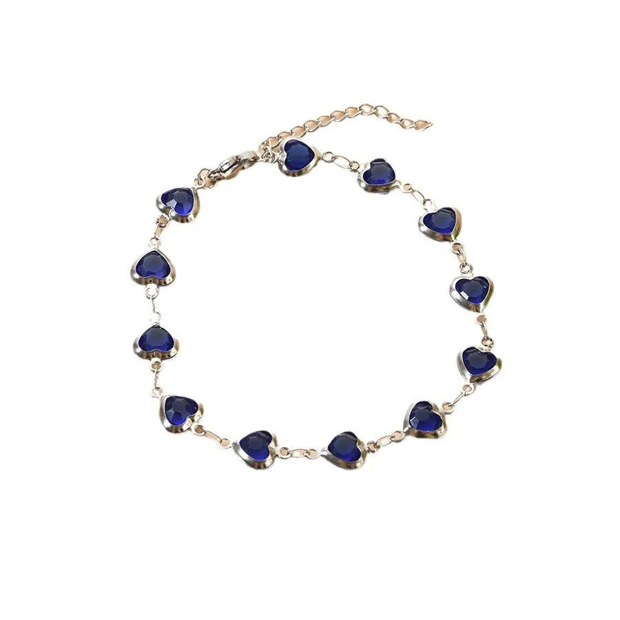 Devil's Eye Creative stainless steel heart bracelet in one of six electroplated colours on a wrist.