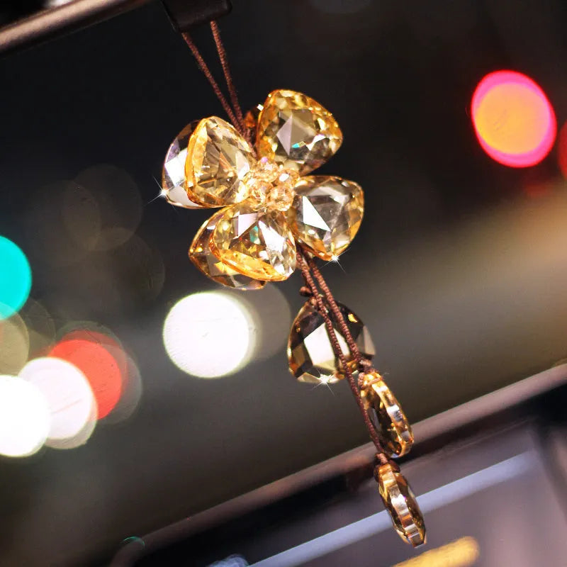 Crystal Four Leaf Grass car pendant decoration in transparent, champagne, black, and shiny finishes, approximately 20 cm long.