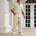 Men's apricot coloured cotton linen casual short-sleeved shirt and trouser set laid flat.