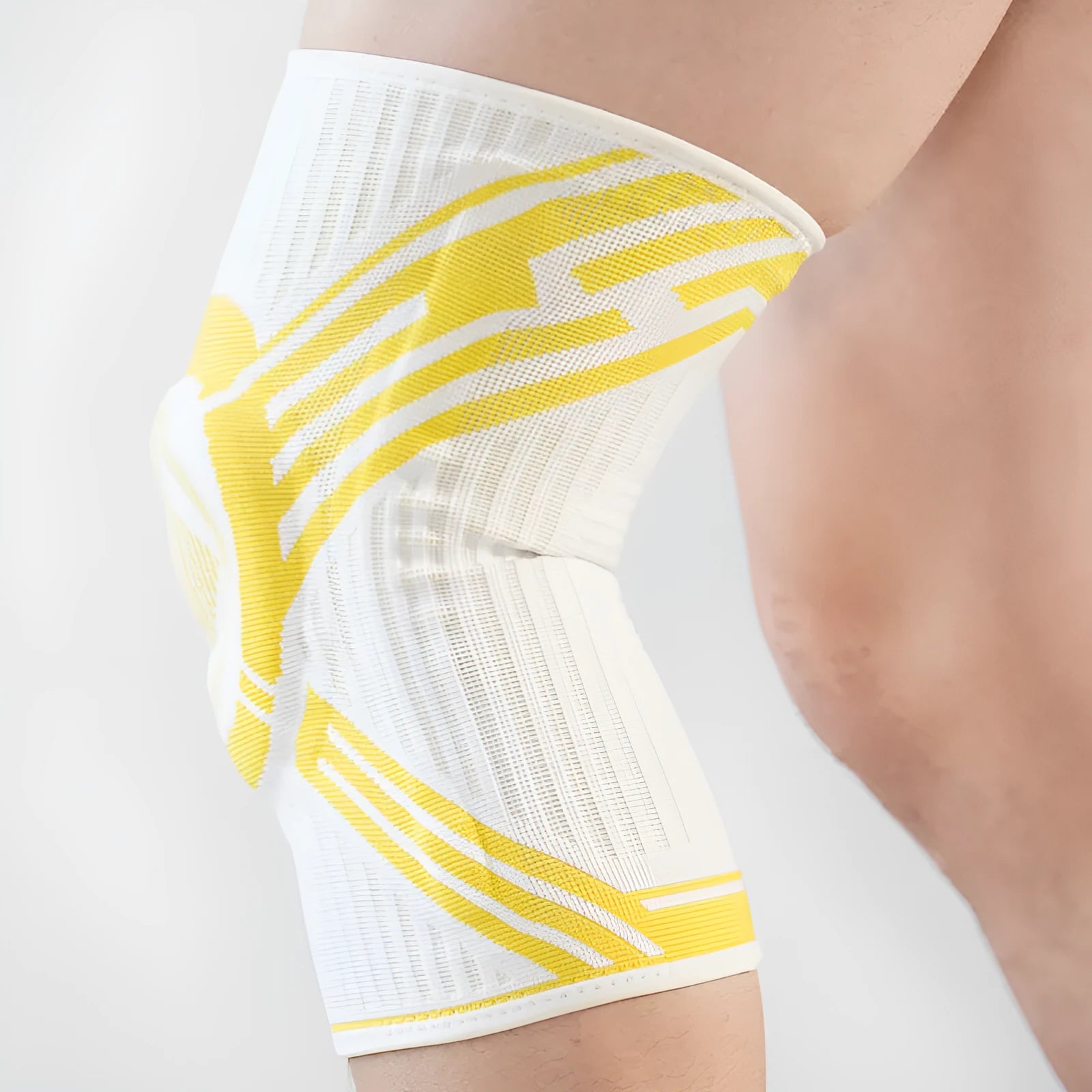 Adult elastic cotton knee pad for sports in blue, shown on a knee.