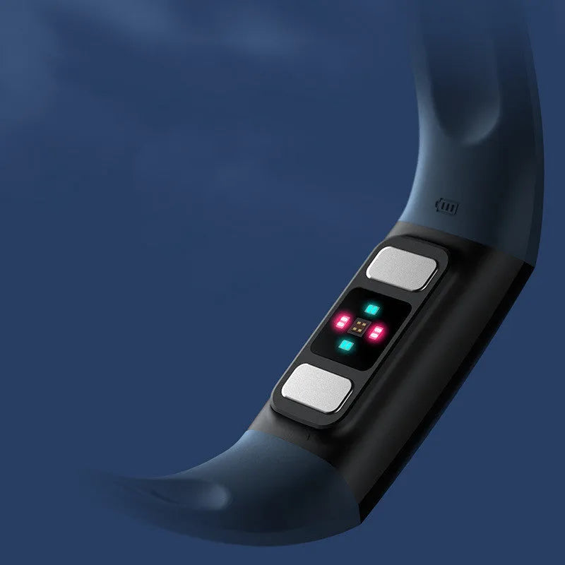 Black smart bracelet with screen showing blood pressure and heart rate data on a wrist.