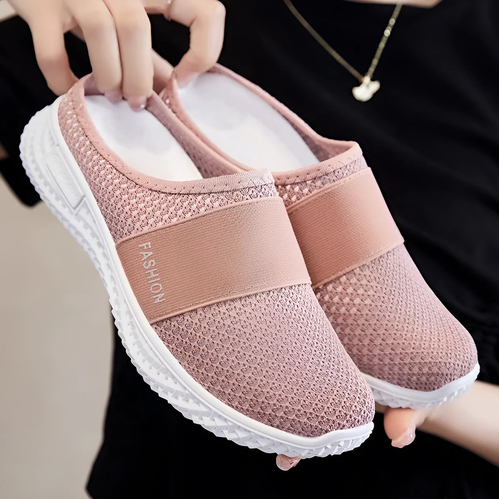 Women's casual flat shoes with mesh upper and hollow-out design in black, grey, pink, or purple.
