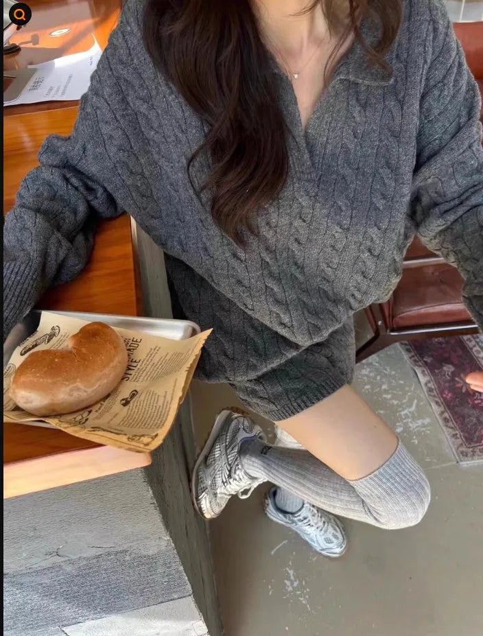 Women's creamy-white cable knit sweater and shorts set with geometric pattern and elastic waistband.
