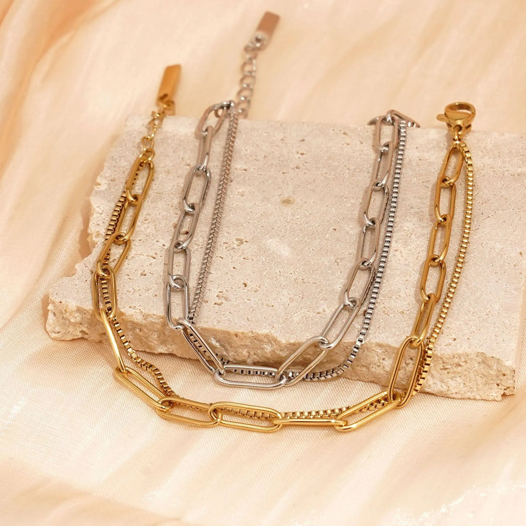 Double layer geometric stainless steel bracelet with linear elements in gold or silver electroplated finish