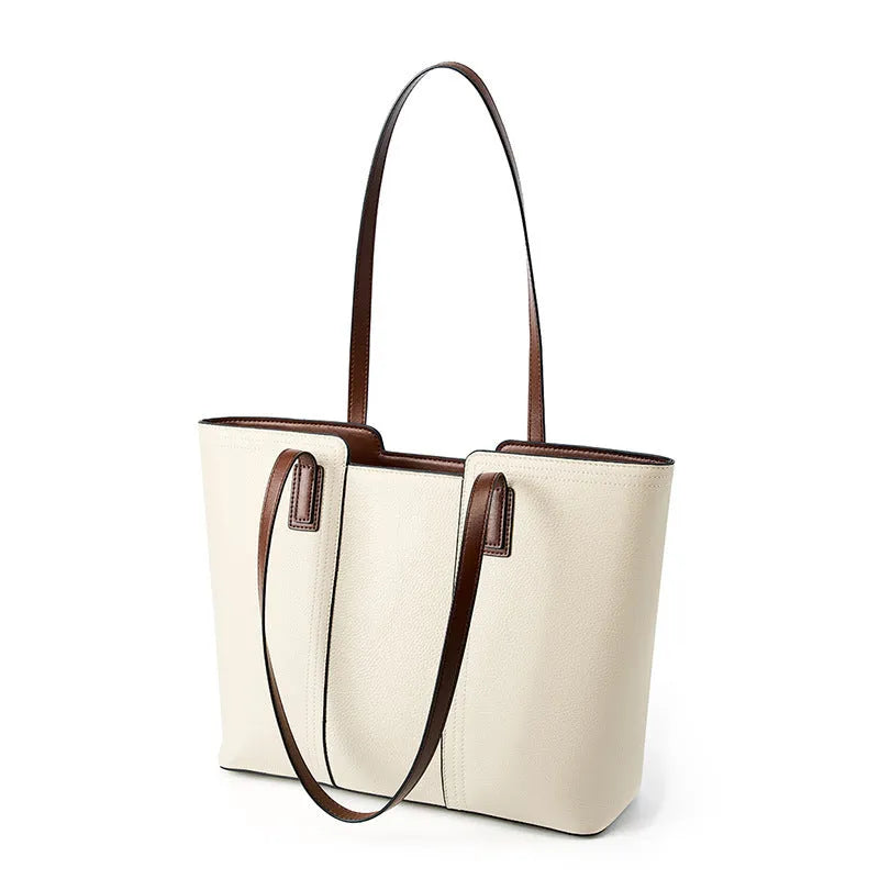 Women's black genuine cowhide leather commuter shoulder bag with horizontal square shape and multiple internal compartments