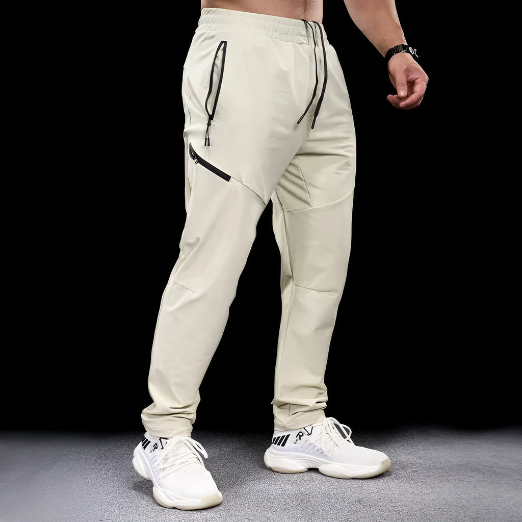 Men's waterproof quick-drying nylon workout pants in multiple colours for sports and fitness
