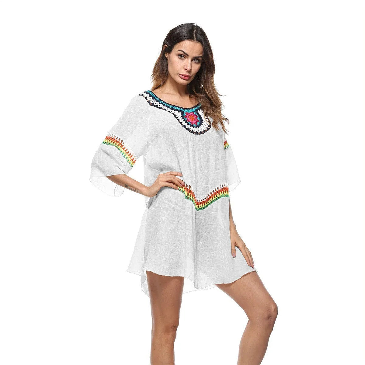 Crocheted ethnic style sun protection beach clothing for women in white, black, sapphire blue, or apricot.