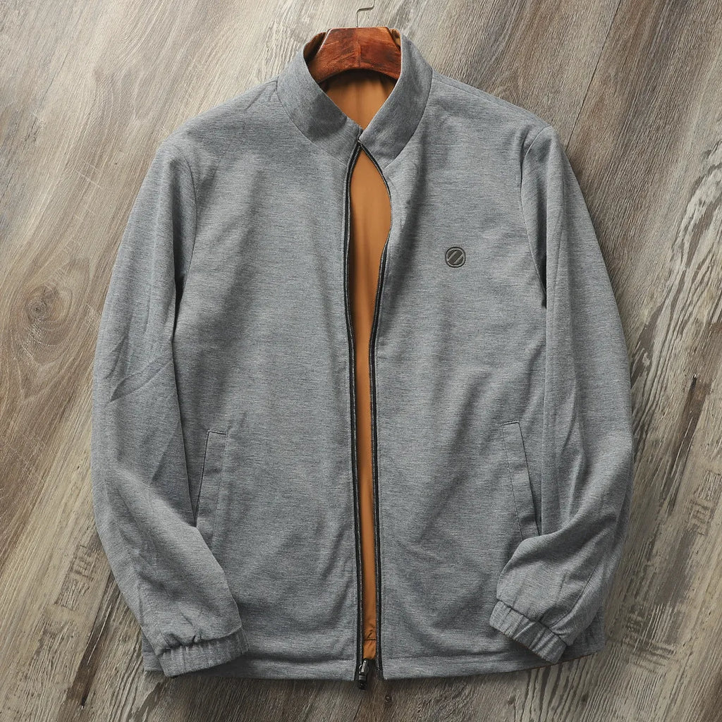 Men's stand collar casual jacket in army green, shown on a model, featuring a simple design with a cotton-lined interior.