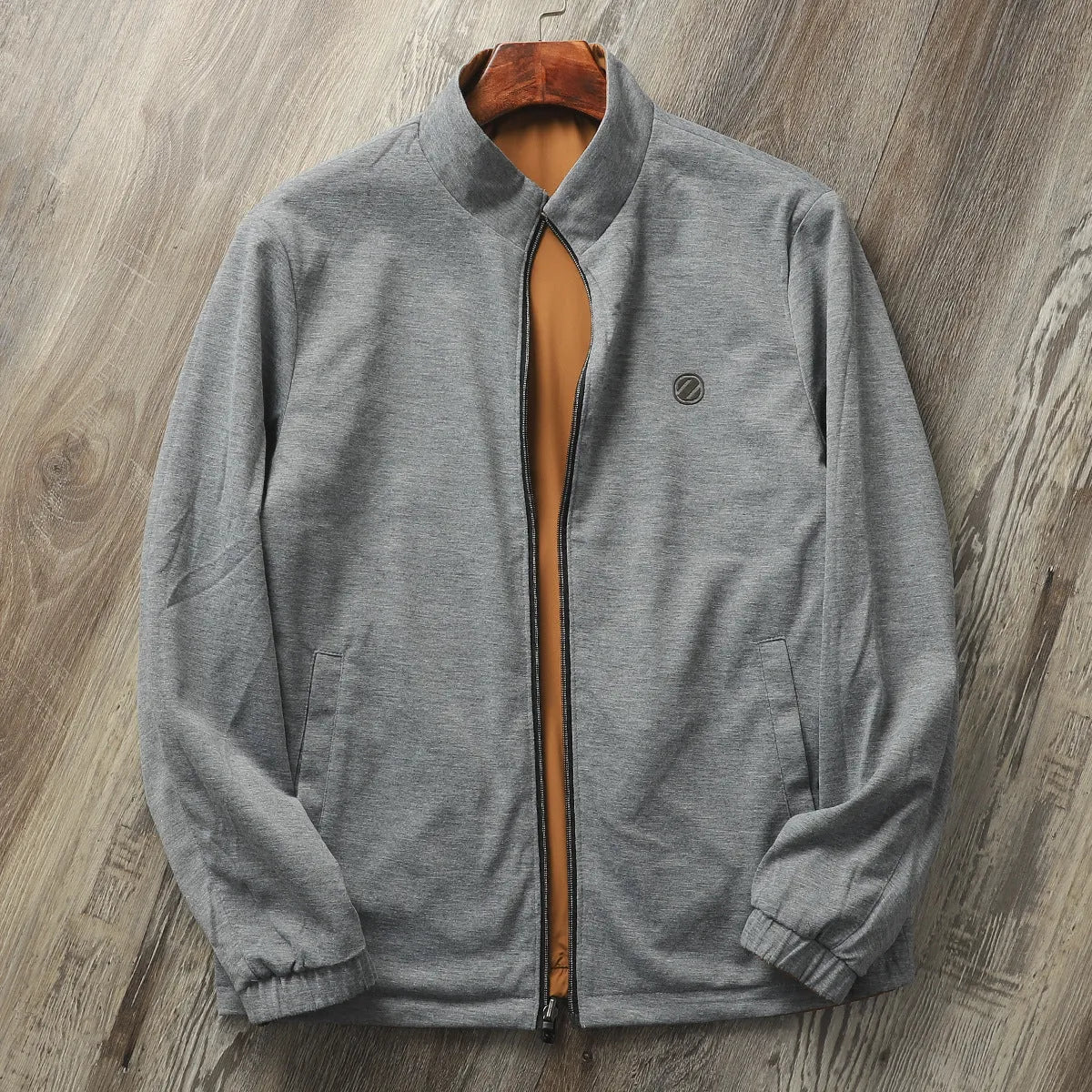 Men's stand collar casual jacket in army green, shown on a model, featuring a simple design with a cotton-lined interior.