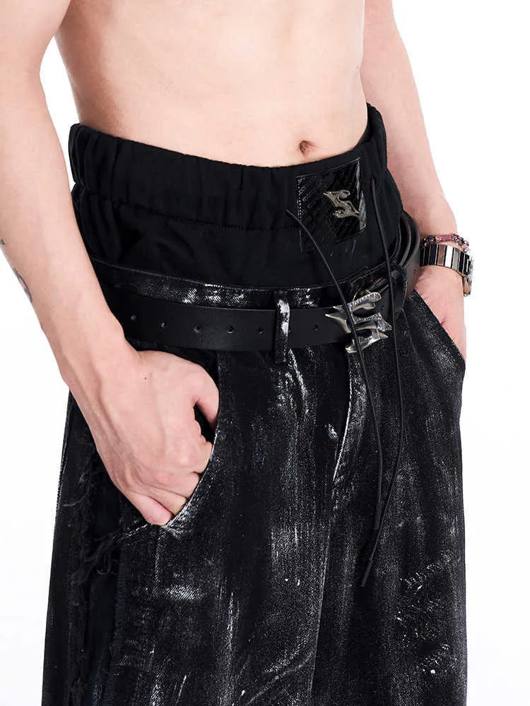 Black men's leather belt with metal letter buckle, showing two-layer cowhide construction.