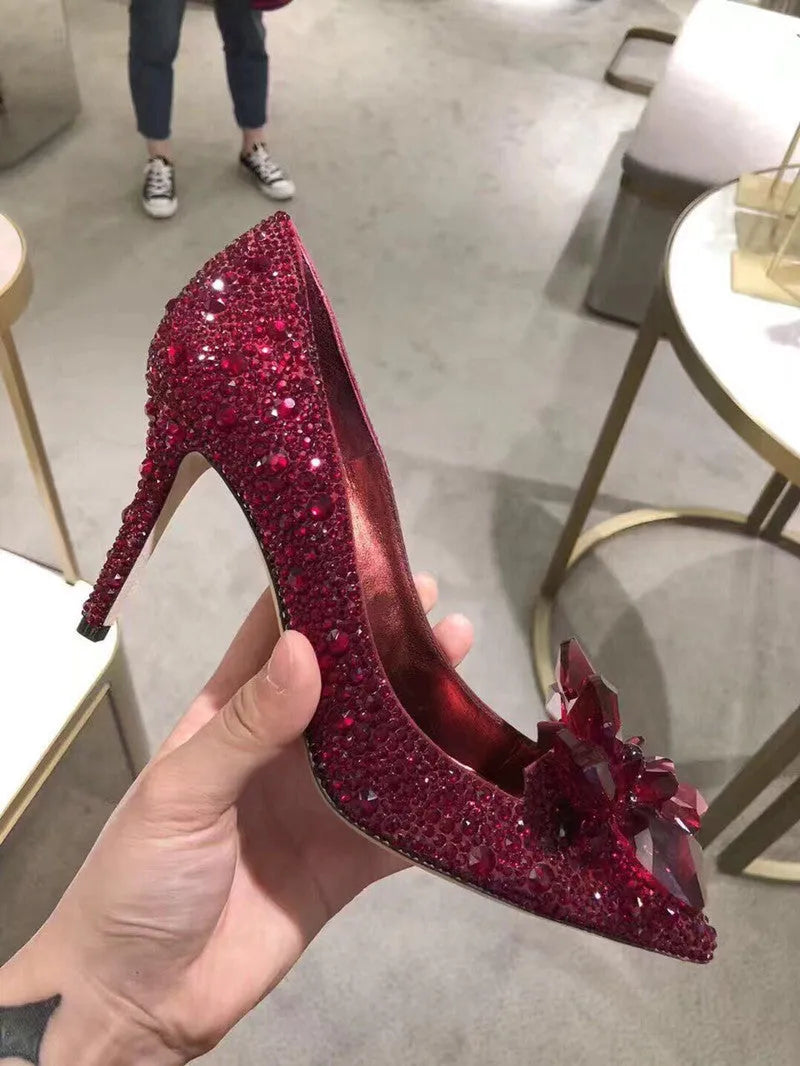 Women's gold stiletto high heels with rhinestone decoration on pointed toe