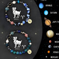 Set of two natural stone bead bracelets showing zodiac sign designs on stretch cords
